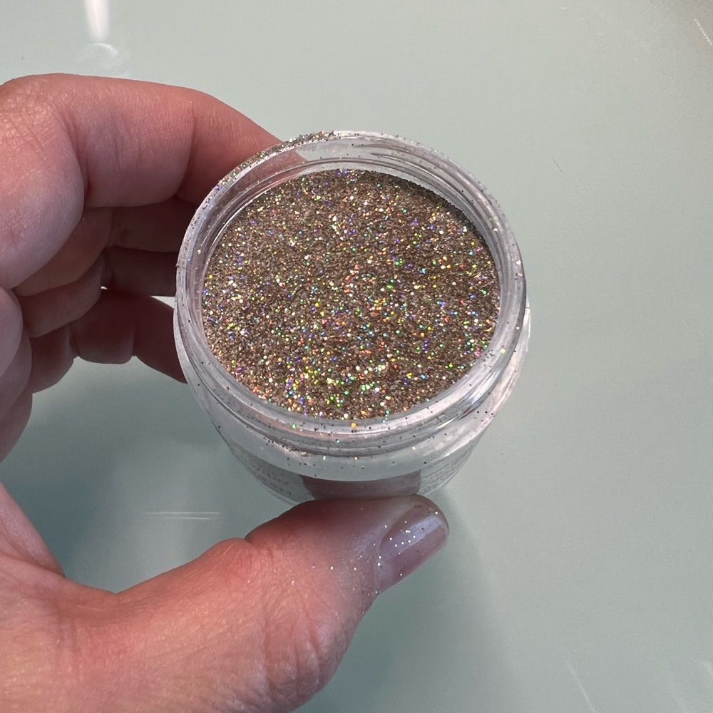 Revel Nail Dip Powder Thia gold with iridescent glitter shimmer